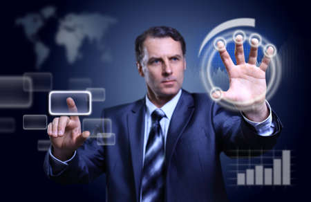 Businessman pressing high tech type of modern buttons on a virtual background 