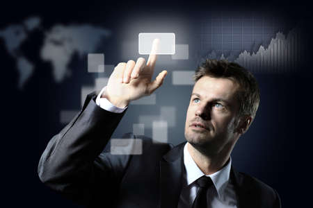 business man pressing a virtual buttonの写真素材
