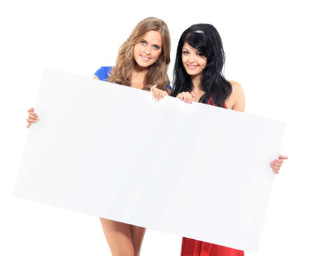 Two women with big white empty bannerの写真素材