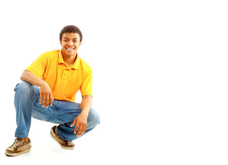 Handsome young casually dressed African man laying down の写真素材