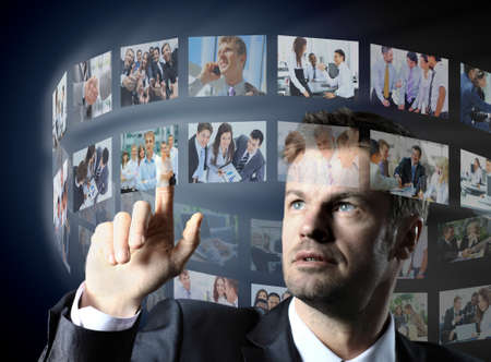 business man pressing a virtual buttonの写真素材