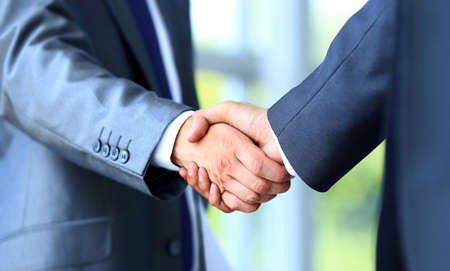 Two businessman shaking hands