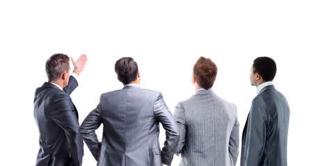 four business mans from the back - looking at something over a white background