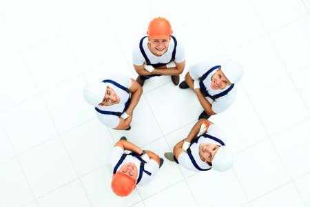Large group of workers standing in circleの写真素材