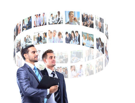 business men looking a virtual buttonsの写真素材