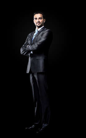 businessman isolated over black backgroundの写真素材