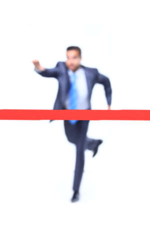 businessman runs to goal over white backgroundの写真素材