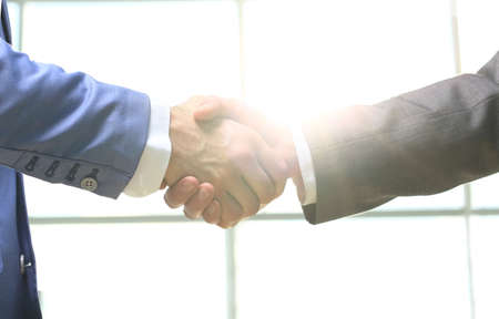 Business handshake. Morning at the office