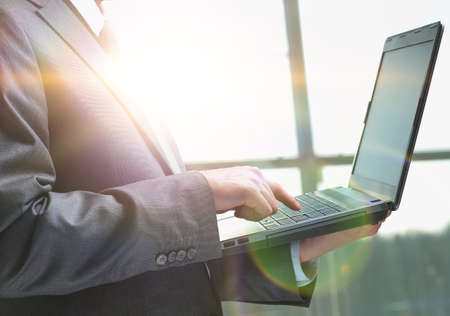 businessman working on a laptop in the office early in the morningの写真素材