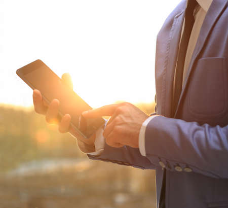 man holding digital tablet, closeupの写真素材