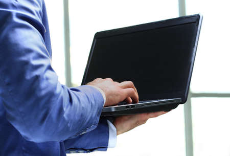 Businessman using laptop in the office