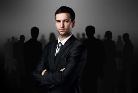 business team standing over a dark backgroundの写真素材