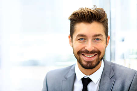 Male casual office worker smiling in officeの写真素材