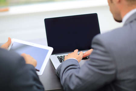 business people working with digital tablet and laptop at officeの写真素材