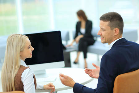 Business partners working on computer at modern office
