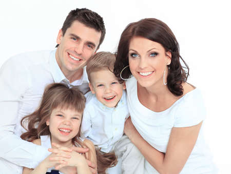 Beautiful happy family - isolated over a white backgroundの写真素材