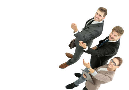 Happy smiling young business people pointing at wallの写真素材