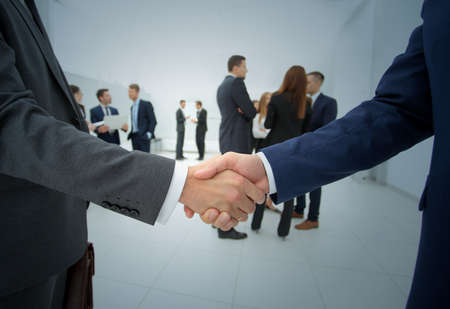 Business people shaking hands, finishing up a meetingの写真素材