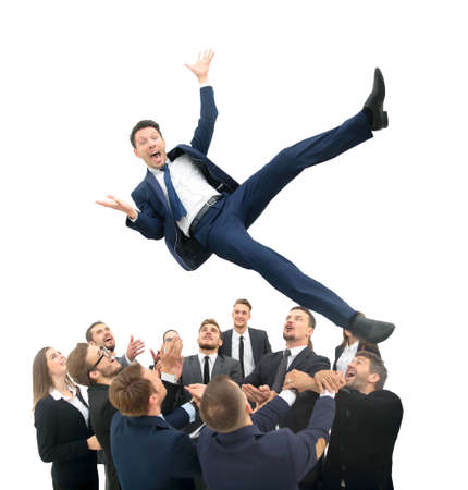 Group of jubilant business people jumping for joy and shouting in their excitement at their success isolated on whiteの写真素材