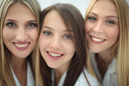 Beautiful female doctors are making selfie  and smiling
