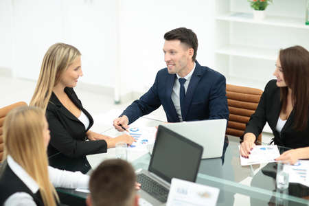 Happy business people talking on meeting at office