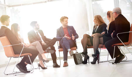 Head of the new business project holds a meeting with his business team.