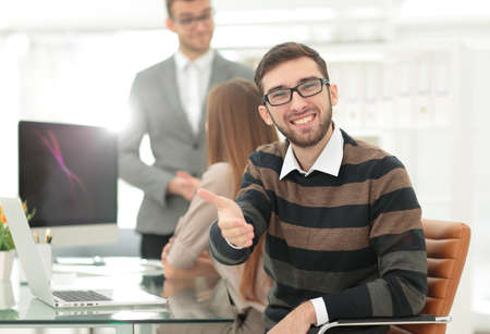 friendly businessman offers a handshake