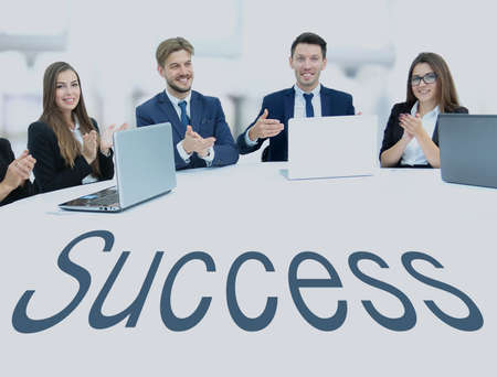Business team, sitting at athe round table on white background.の写真素材