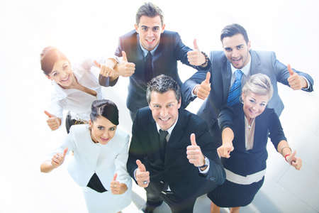 Top view of executives smiling and pointingの写真素材