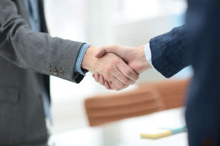 businessman shaking hands to seal a deal with his partnerの写真素材