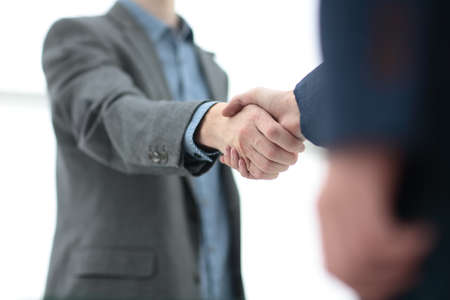 businessman shaking hands to seal a deal with his partnerの写真素材