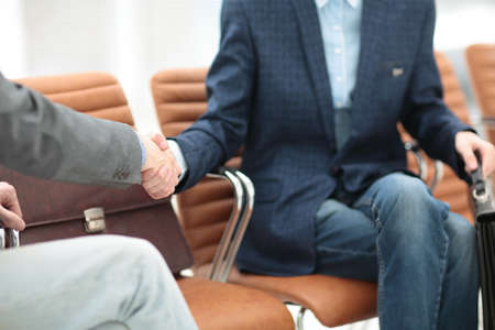 businessman shaking hands to seal a deal with his partnerの写真素材