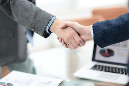 businessman shaking hands to seal a deal with his partnerの写真素材