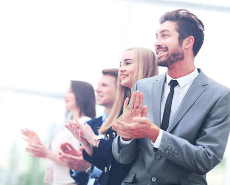 Satisfied proud business team clapping handsの写真素材