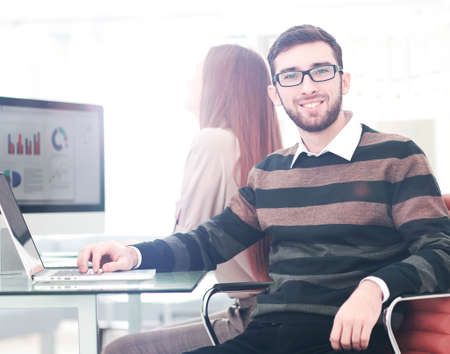 Successul business man working in an modern sunny office. Analyzの写真素材