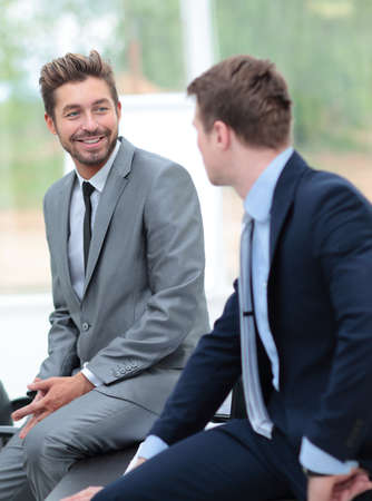 Two handsome businessmen working together on a project in the ofの写真素材