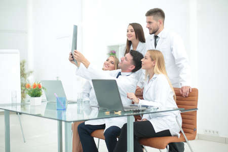 Smiling doctors are analyzind the x-ray. Medical office interiorの写真素材