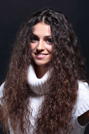 Woman with beauty long brown hair - posing at studio