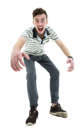 Young man celebrating his success over white background