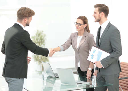 Business people closing a deal and handshaking at the office