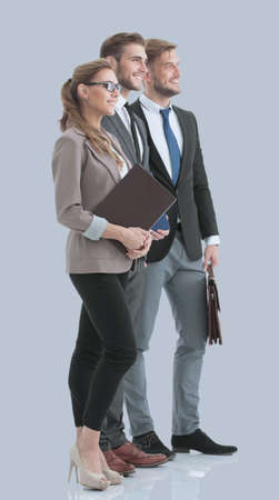 Team of successful and confident people posing on a gray backgroの写真素材