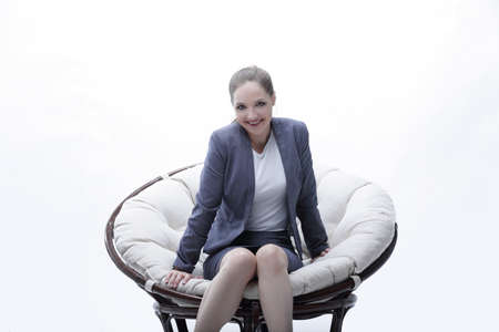 business woman sitting in a round chair rattanの写真素材