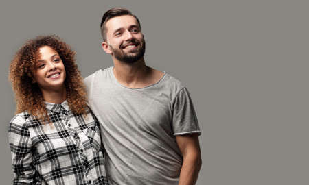 young couple discussing their dreams and pointing forward.の写真素材