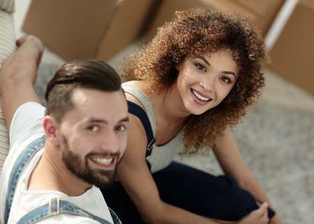 Happy young couple in a new apartment.の写真素材