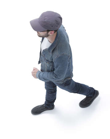 view from above. guy in a baseball cap and denim jacket