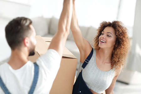 Happy and young couple giving a high fiveの写真素材