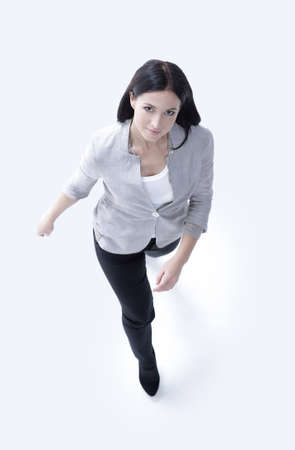 successful woman goes forward. in full growth. view from above.の写真素材