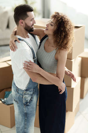 married couple when moving to a new house. Concept of family happiness.