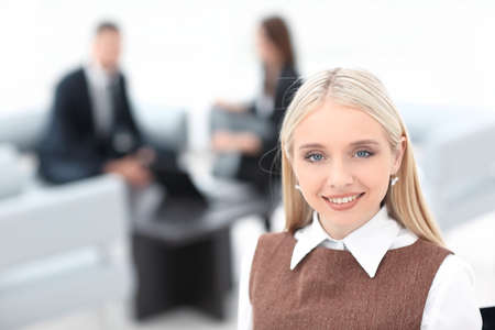 young business lady on blurred background officeの写真素材