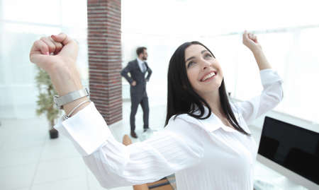 successful happy business woman sitting at the desk.